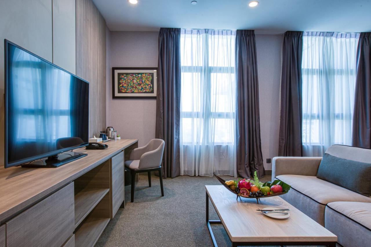 Mercure Living Путраджая Экстерьер фото A living room in a serviced apartment in Moscow, Russia